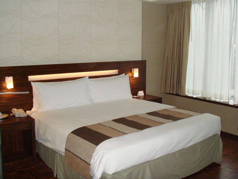 Nina Hotel Tsuen Wan West Hong Kong Dış mekan fotoğraf A bed
